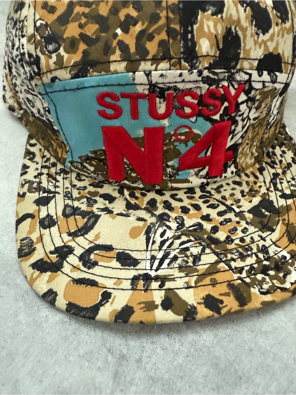 Stussy Kids Leopard Print Cap with Red N4 and Aqua Patch